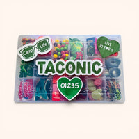 CandyCakeExplosion Camp XL tackle box filled with assorted colorful candies, featuring Taconic camp branding and stickers.