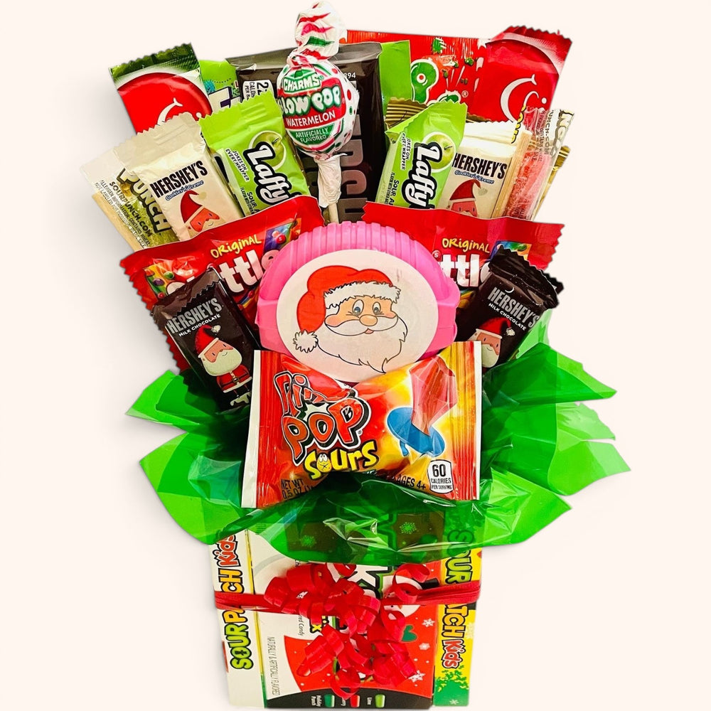 CandyCakeExplosion small Christmas bouquet featuring assorted chocolates, holiday candies, and a festive Santa accent.