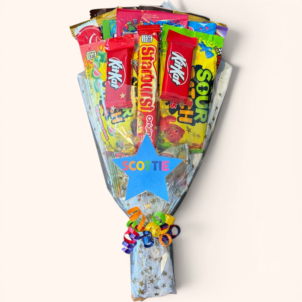 CandyCakeExplosion Dance Bouquet featuring assorted candy bars and chocolates wrapped with a star tag and ribbon.