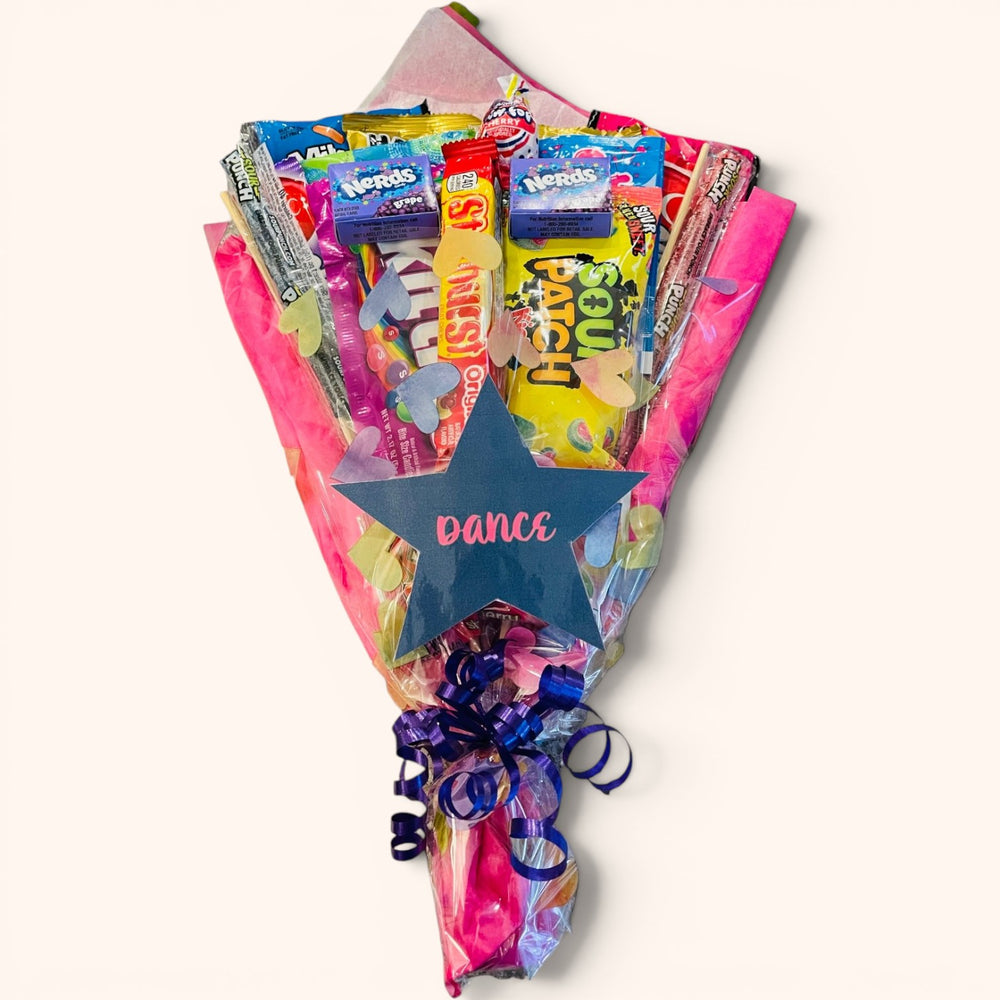 CandyCakeExplosion Dance Bouquet featuring assorted fruity gummies and sour candies wrapped in pink and purple paper.