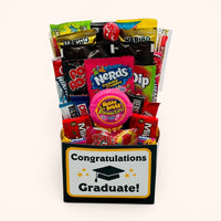 CandyCakeExplosion Congrats Graduate candy bouquet featuring 25 assorted full-size and fun-size treats in a gift box.