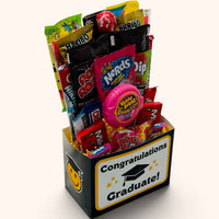 CandyCakeExplosion Congrats Graduate candy bouquet in a black box with graduation cap icon and assorted sweet treats.