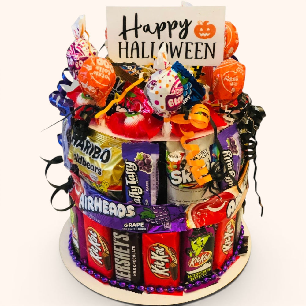 CandyCakeExplosion small Halloween candy cake featuring assorted chocolates, candy bars, and a Happy Halloween sign.