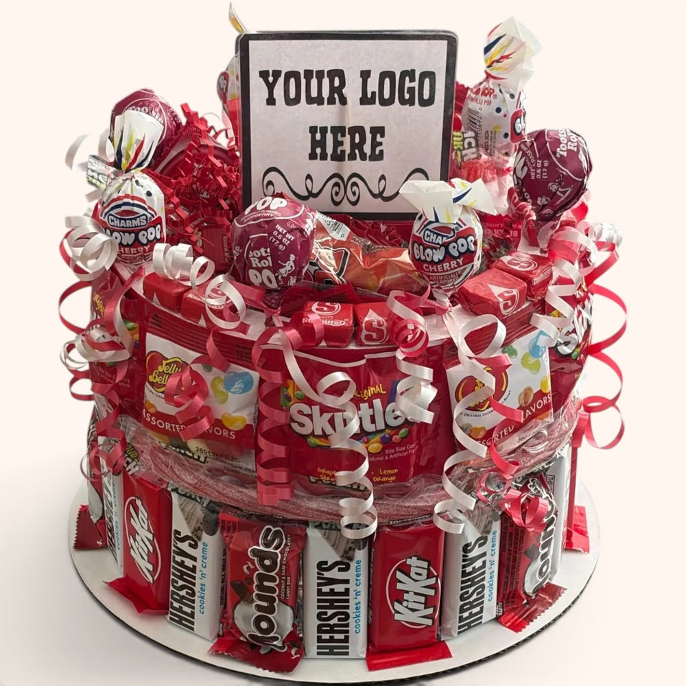 CandyCakeExplosion medium college candy cake featuring assorted chocolate bars, lollipops, and Skittles with red ribbons