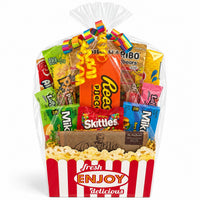 CandyCakeExplosion Movie Night Bouquet with assorted candy bars, chocolates, and popcorn in a movie-themed basket.