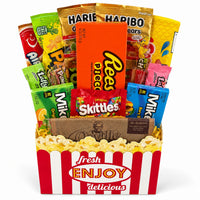 CandyCakeExplosion Movie Night Bouquet featuring assorted chocolates, candy bars, and popcorn in a theater-style box.