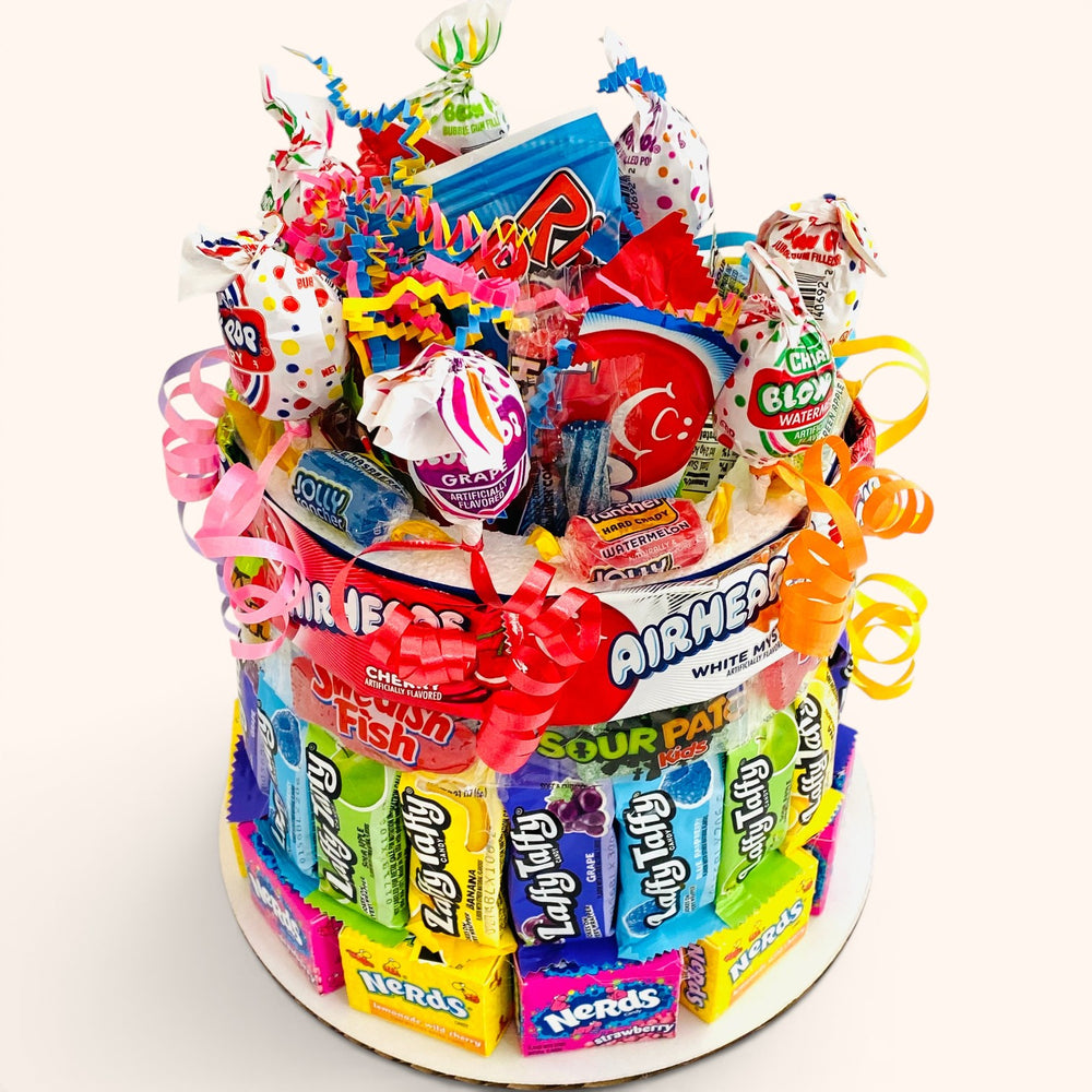CandyCakeExplosion small rainbow candy cake featuring assorted gummies, sour chews, and fruity treats with colorful ribbons