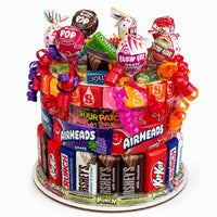 CandyCakeExplosion Small Full Of Sunshine candy cake featuring tiered milk chocolates, candy bars, and colorful lollipops