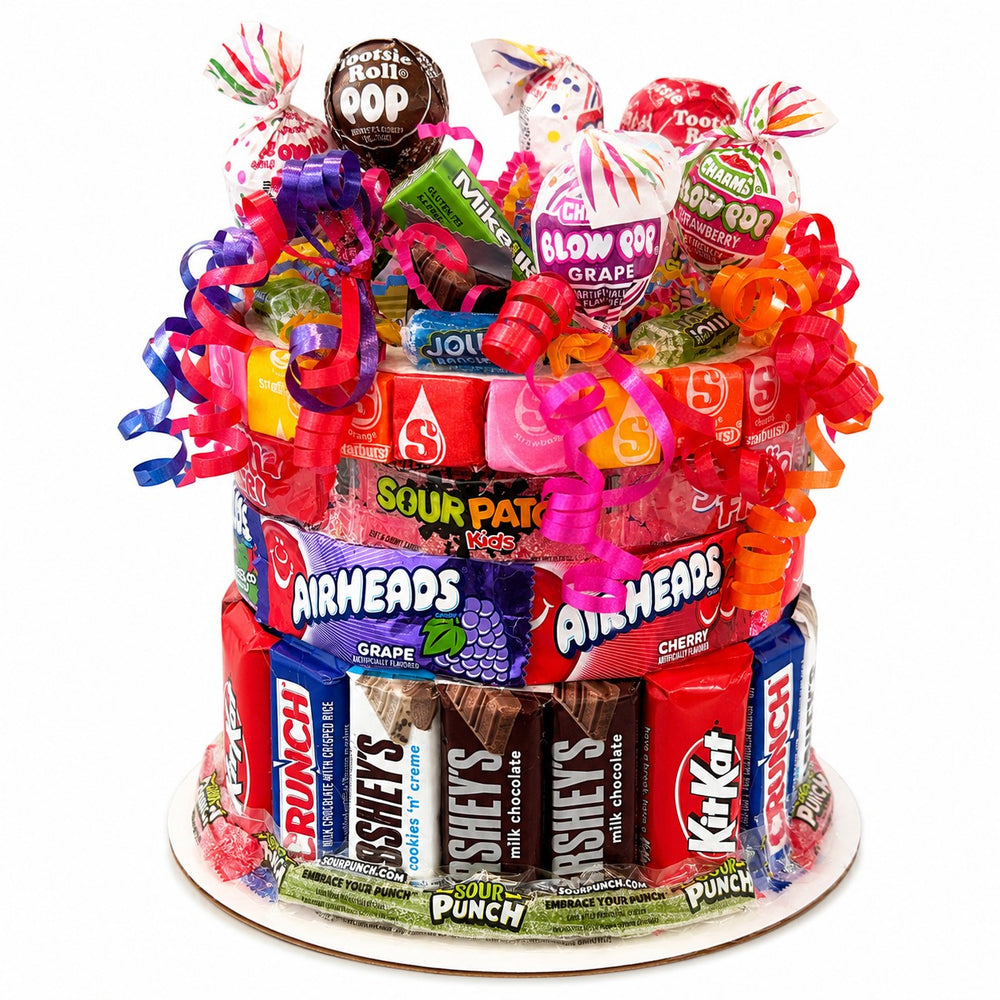 CandyCakeExplosion small candy cake featuring assorted chocolates, Airheads, and lollipops with bright curly ribbons.