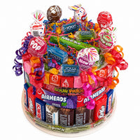 CandyCakeExplosion small candy cake with yellow theme, milk chocolates, candy bars, and colorful ribbons.