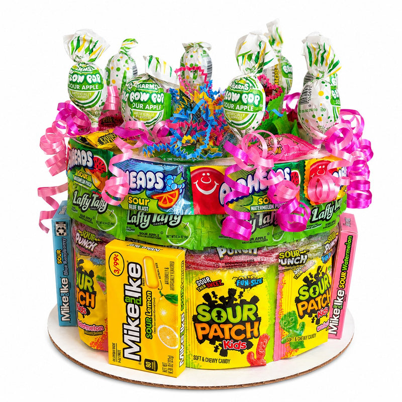 CandyCakeExplosion medium tiered sour candy cake featuring Sour Patch Kids, Laffy Taffy, and Blow Pops with pink bows.
