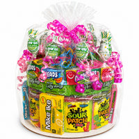 CandyCakeExplosion medium non-chocolate candy cake featuring sour gummy rings, belts, and neon ribbons in cello wrap.