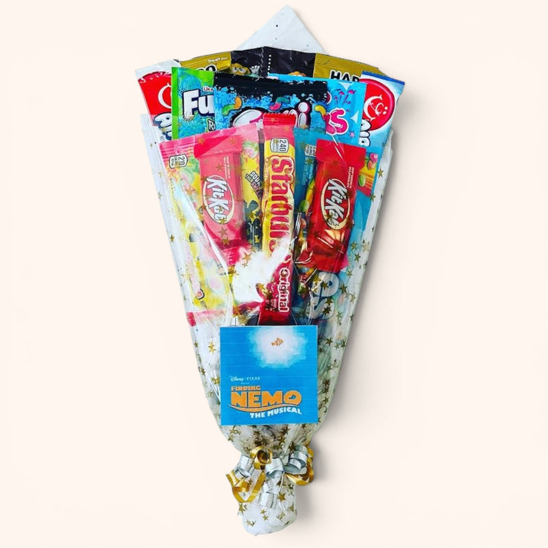 CandyCakeExplosion Theater Bouquet featuring assorted movie theater candy and chocolates in a decorative gift wrap.