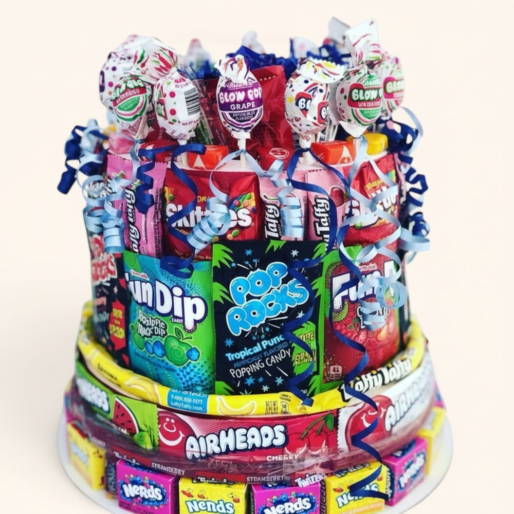 CandyCakeExplosion three-tier candy cake decorated with assorted colorful sweets like Nerds, Airheads, and lollipops.