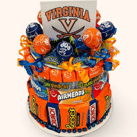 CandyCakeExplosion Virginia college candy cake featuring assorted chocolate bars, lollipops, and festive ribbons.
