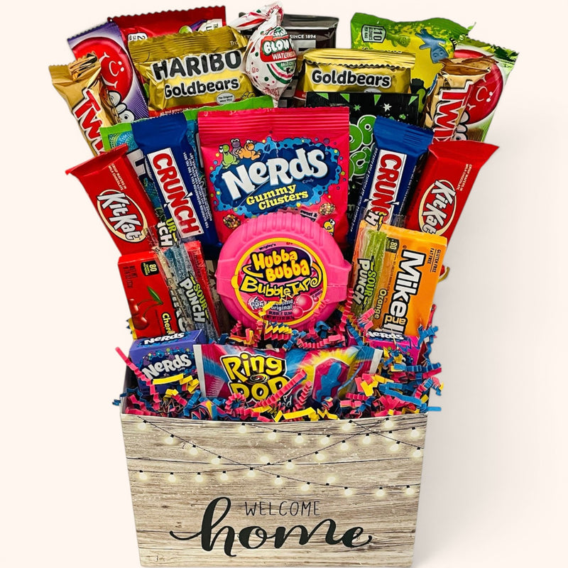 CandyCakeExplosion Welcome Home Bouquet featuring assorted candy bars, Nerds, and chocolates in a decorative box.